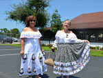 Ladies posed showing Colombian typical dresses