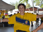 A Colombian woman enjoy the music early starting the event